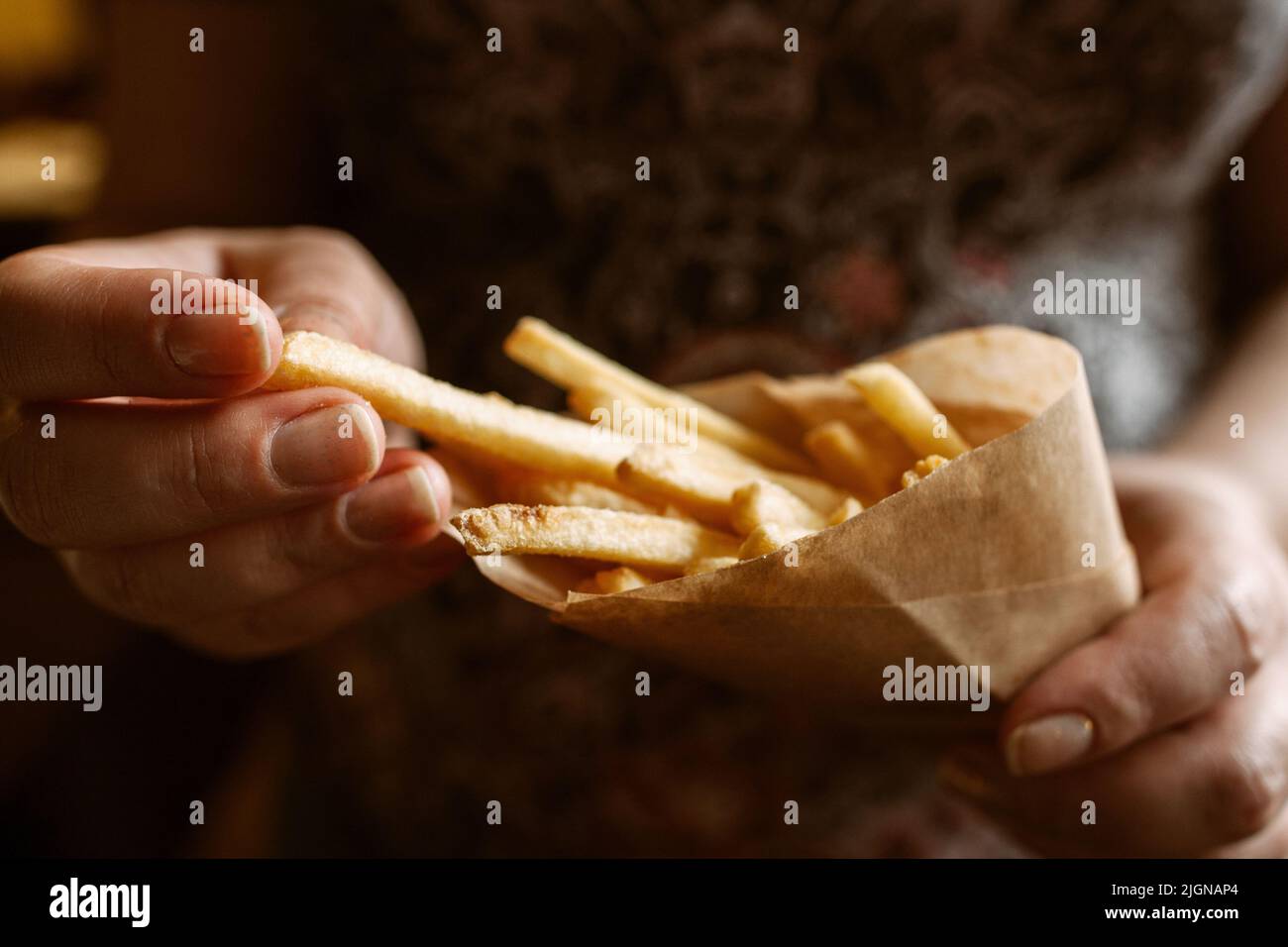 French fries eating closeup Stock Photo Alamy