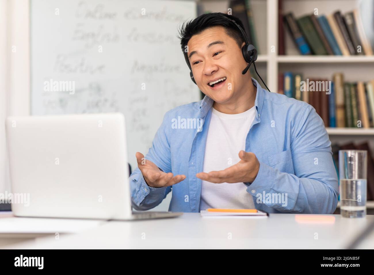 Chinese Teacher Having Class Using Laptop Making Video Call Indoor Stock Photo