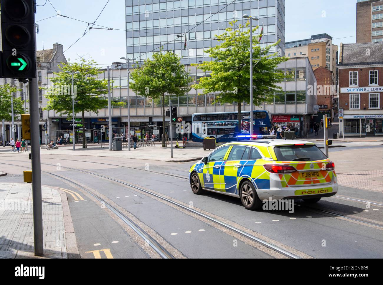 Police Car driving through Nottingham City Centre, Nottinghamshire