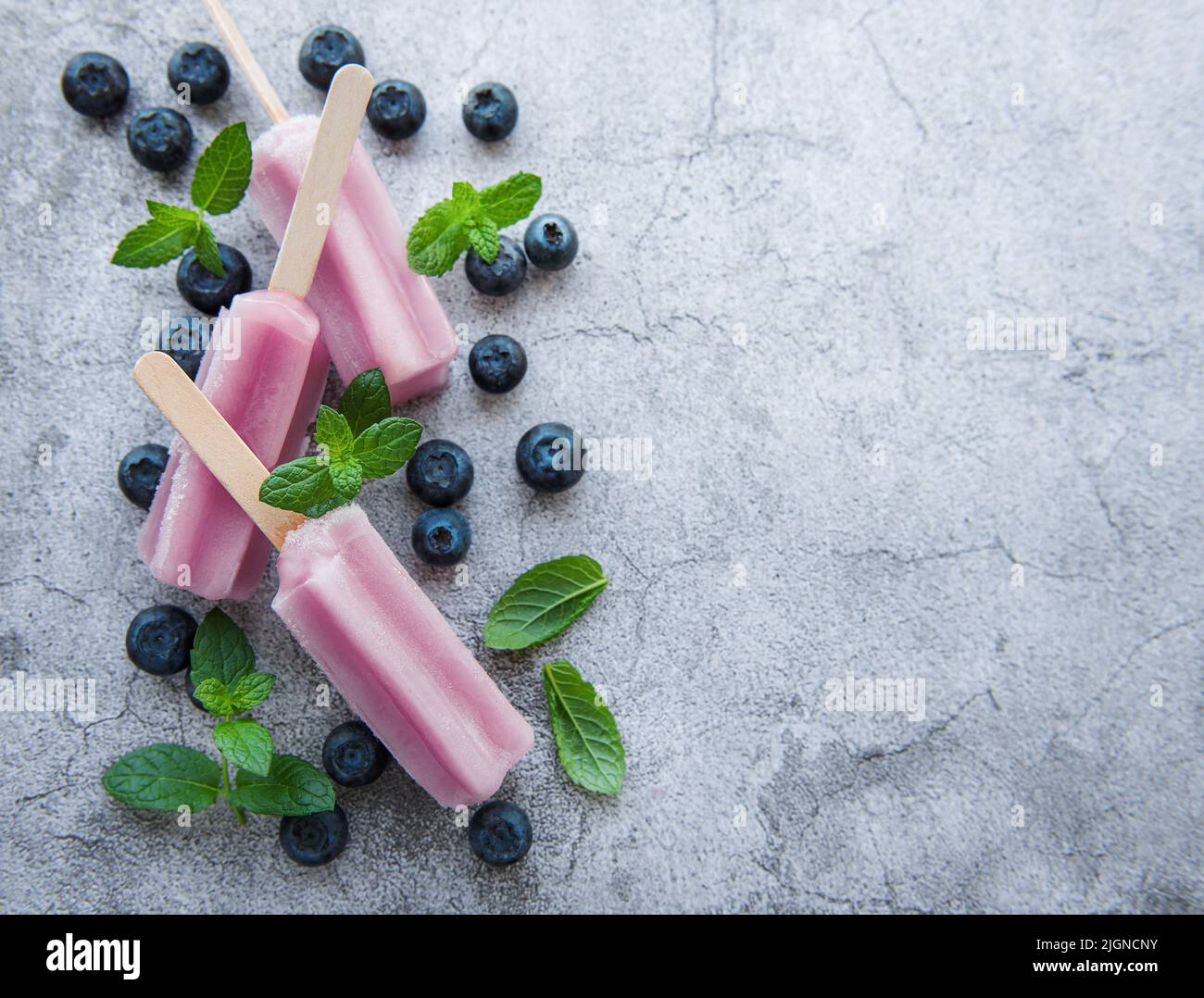 Ice cream popsicles from fresh organic blueberries. Summer sweets and