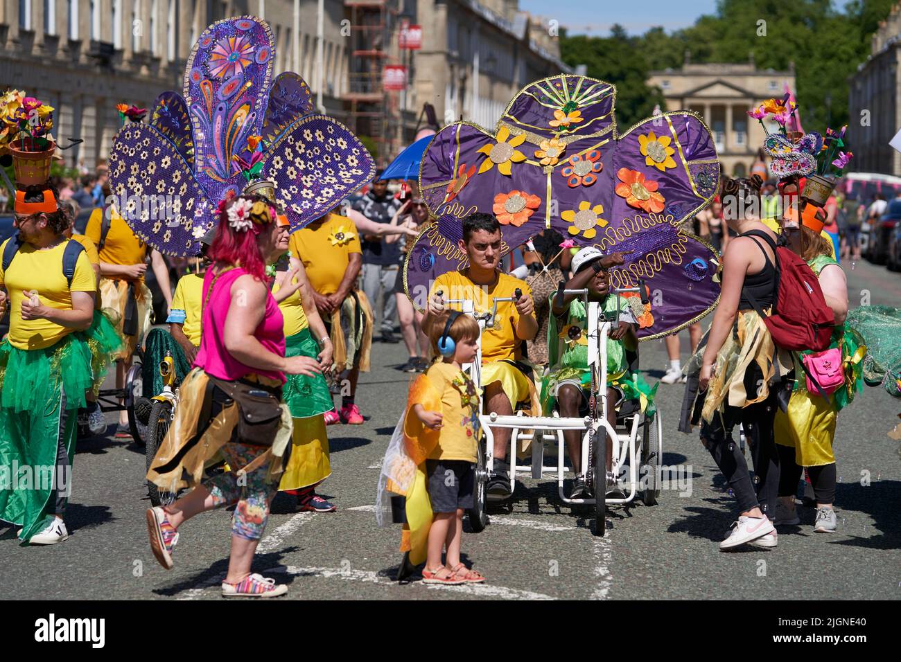 Carnival parade progressing through the streets of the historic city of Bath in Somerset. Stock Photo
