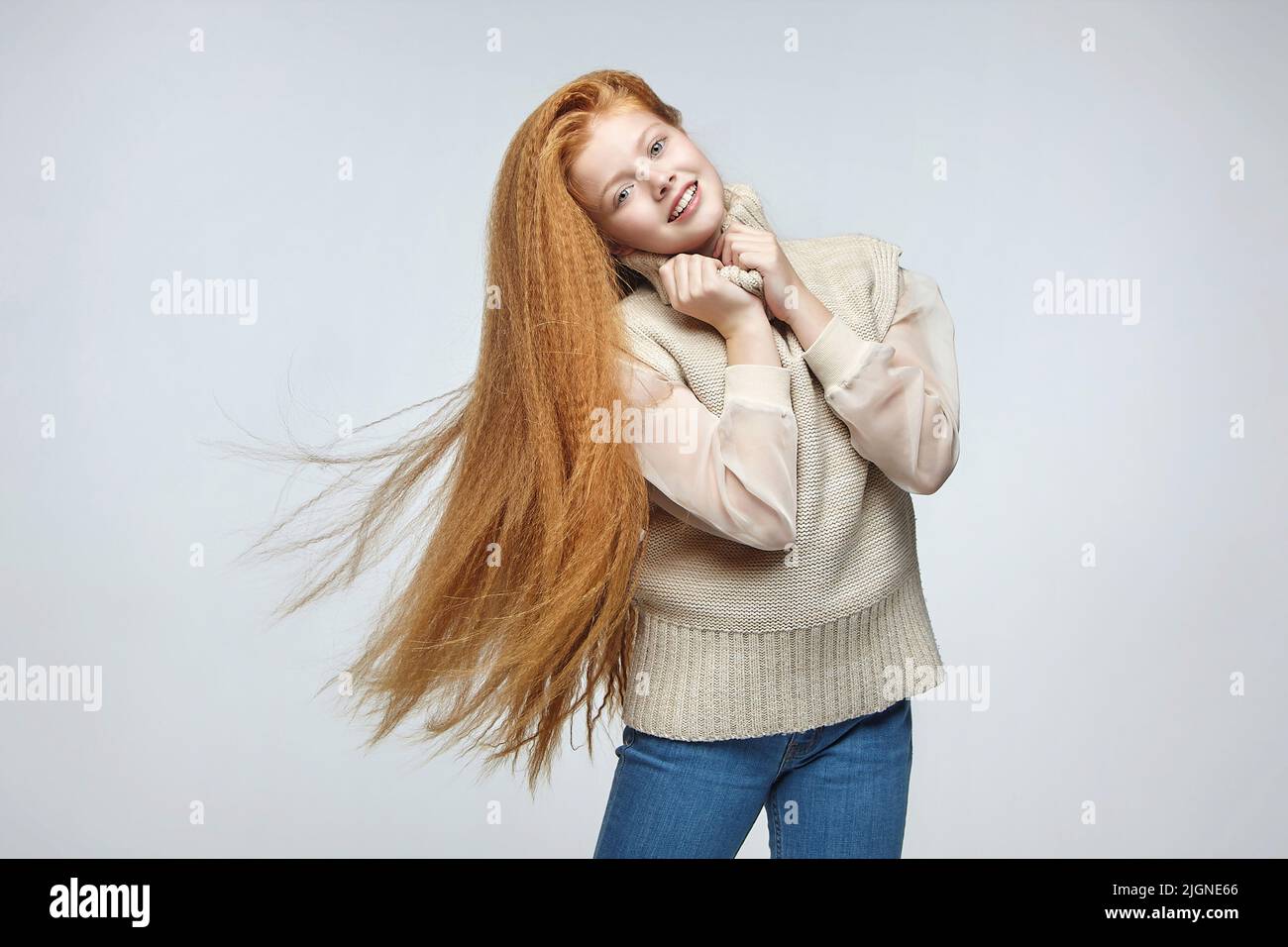 teen girl with long red hair in Studio on white background Stock Photo ...