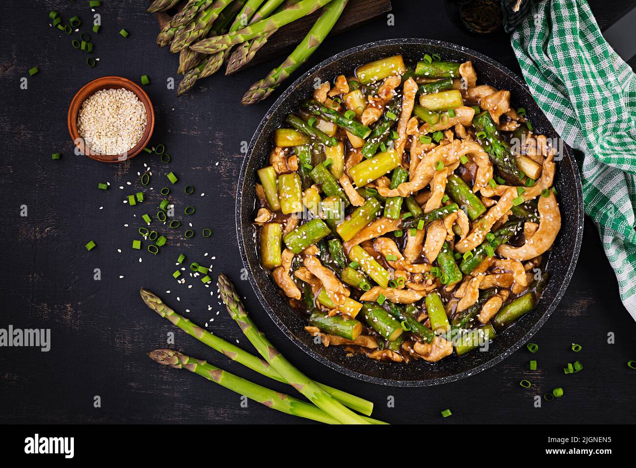 Stir fry with chicken and asparagus. Chicken stirfry.  Chinese food. Top view, above Stock Photo