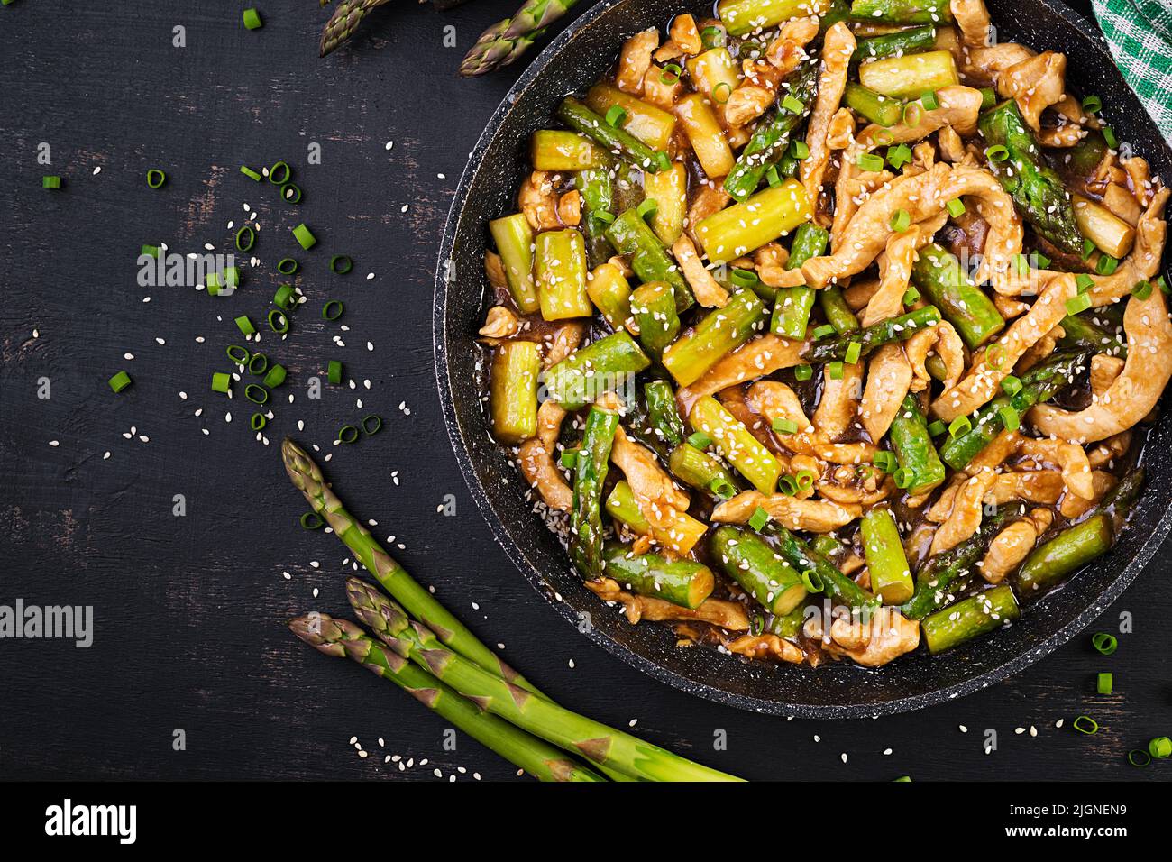Stir fry with chicken and asparagus. Chicken stirfry.  Chinese food. Top view, above Stock Photo