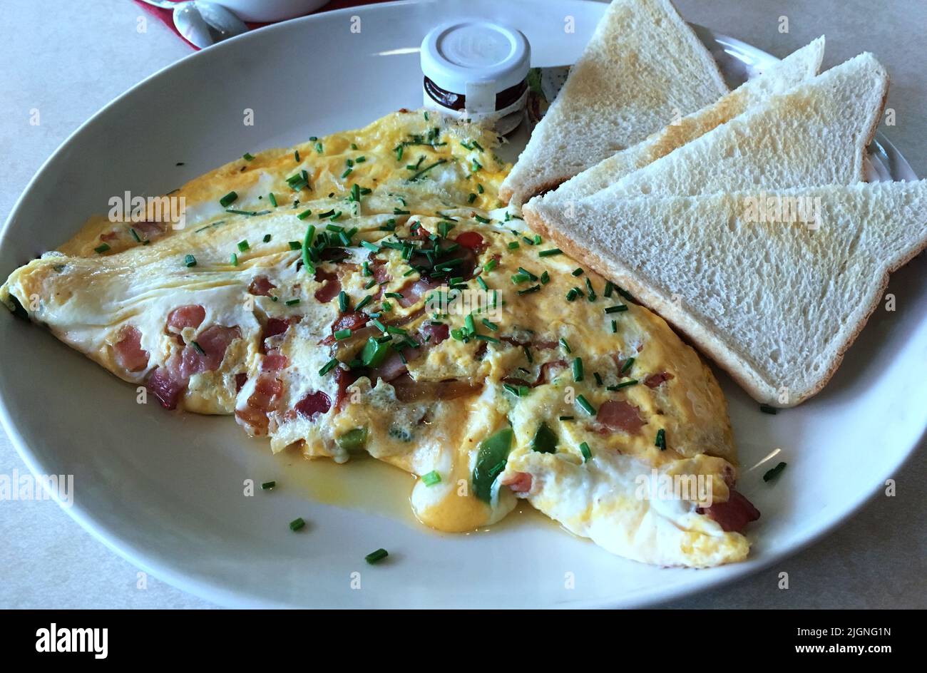 Breakfast is king. Delicious morning breakfast omelet of dice bacon