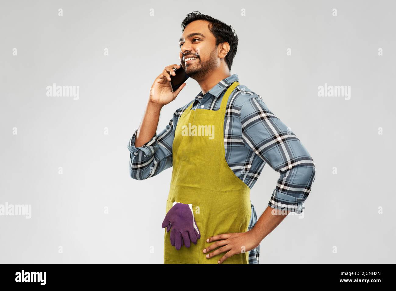 indian gardener or farmer calling on smartphone Stock Photo