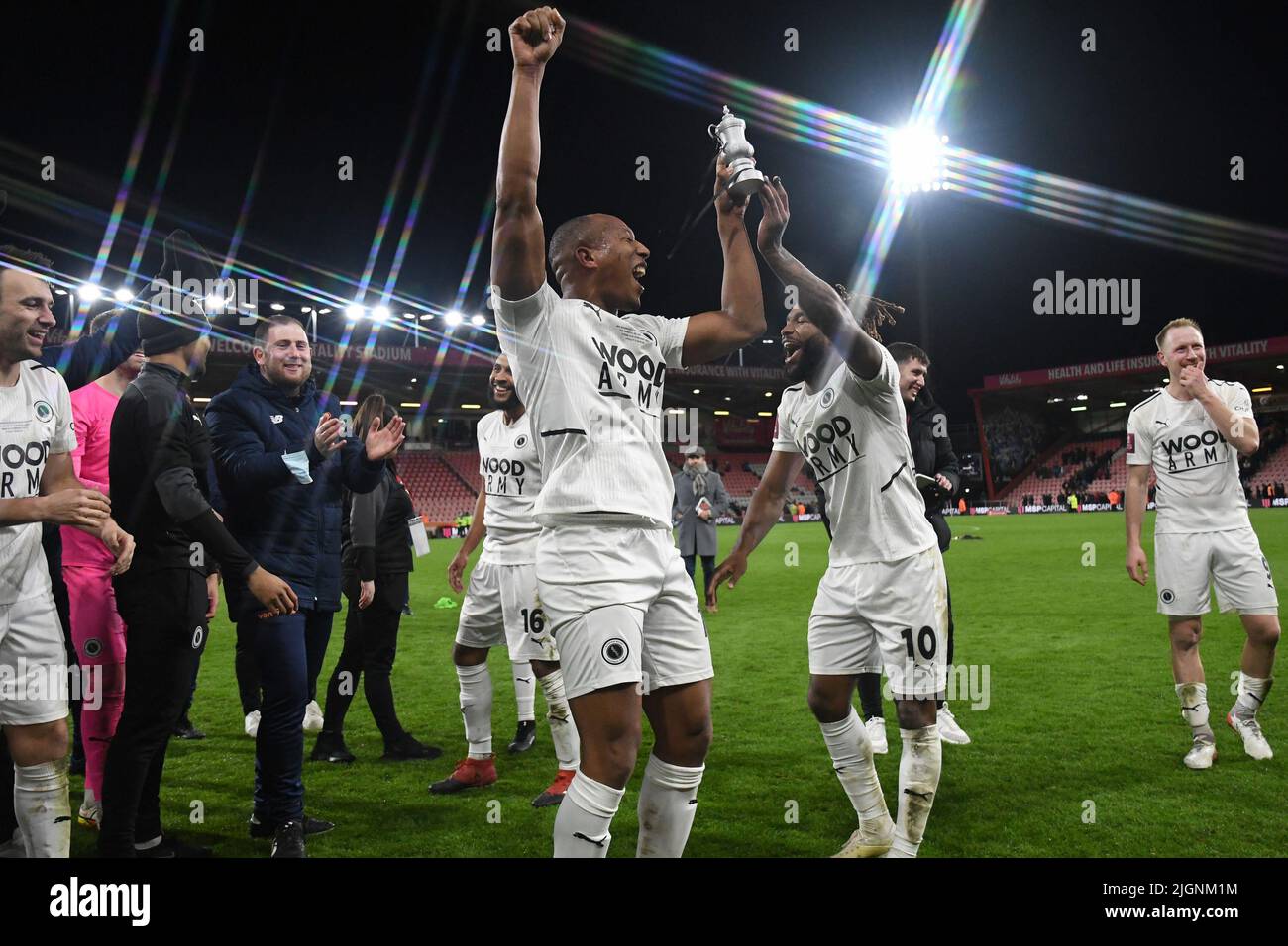 Boreham Wood players celebrate at full time with a miniature FA Cup ...