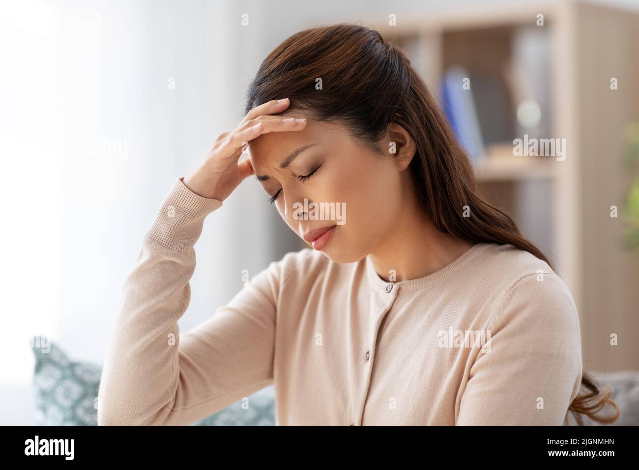 Asian woman feeling headache hi-res stock photography and images - Alamy