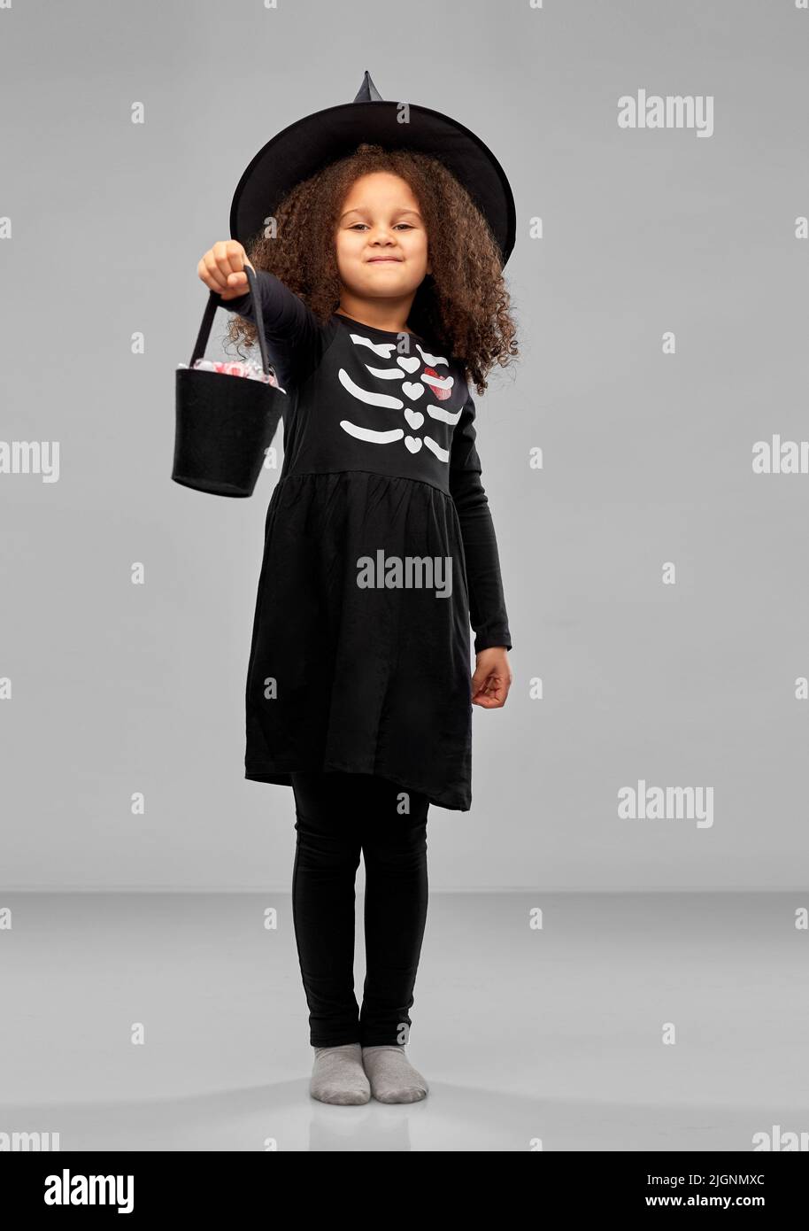 girl with candies trickortreating on halloween Stock Photo Alamy