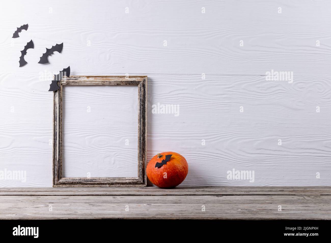 Composition of frame with copy space, halloween decorations and pumpkin ...