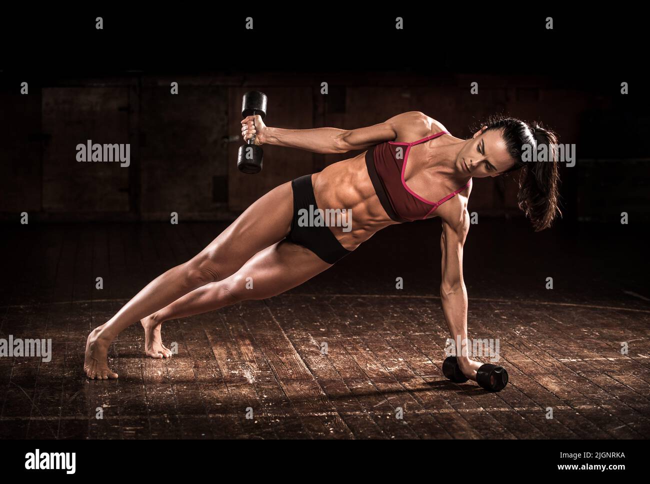 Female fitness model with toned body working out with weights, UK Stock ...