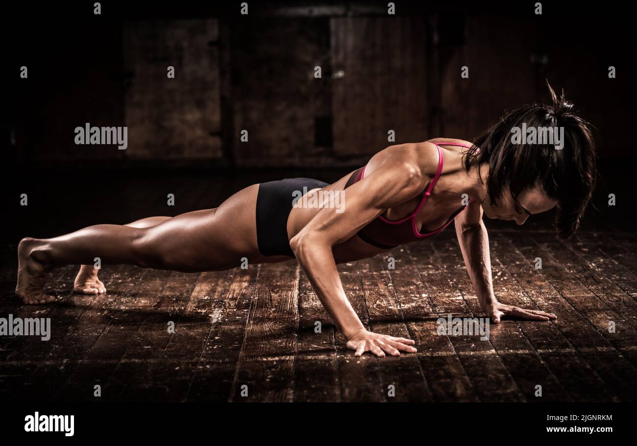 Female fitness model with very lean and toned body muscular body Stock Photo