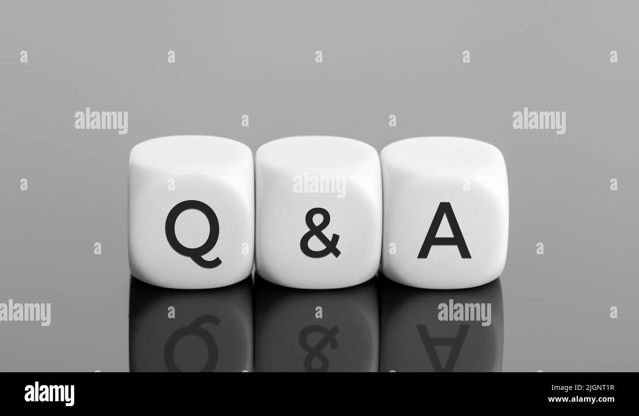 Q&A or questions and answers concept. White blocks shape with text on desk. Copy space Stock Photo