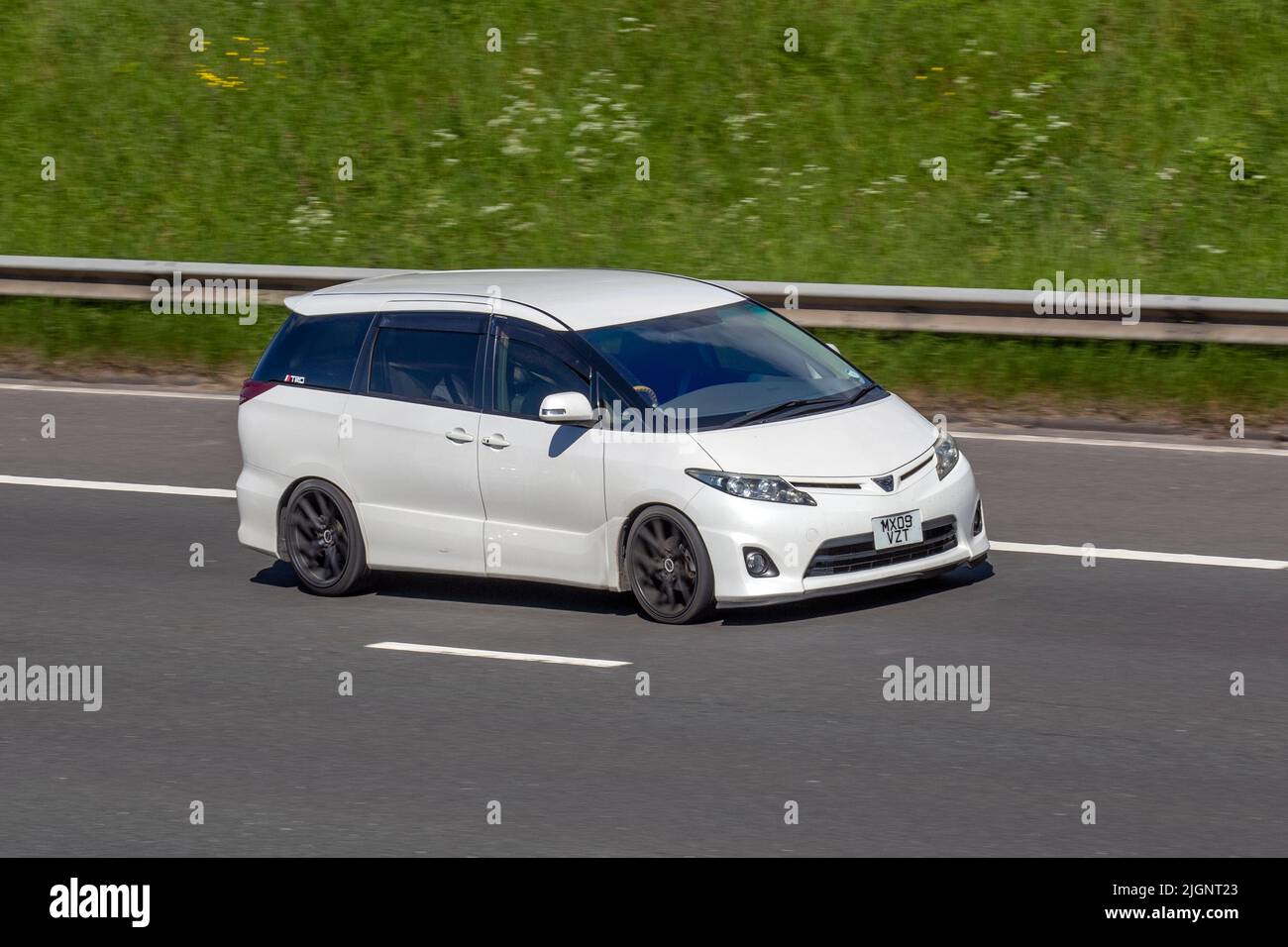 2009 TOYOTA Estima AERAS G Edition HYBRID E-Four X 2360cc. import 8 seater luxurious people carrier; travelling on the M61 Motorway, Manchester, UK Stock Photo