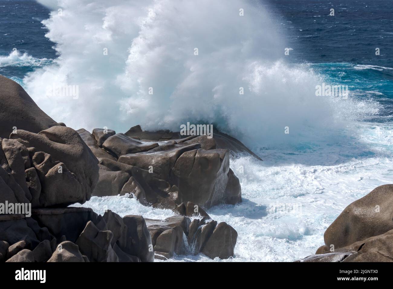 Waves Pounding the Coastline at Capo Testa Sardinia Stock Photo