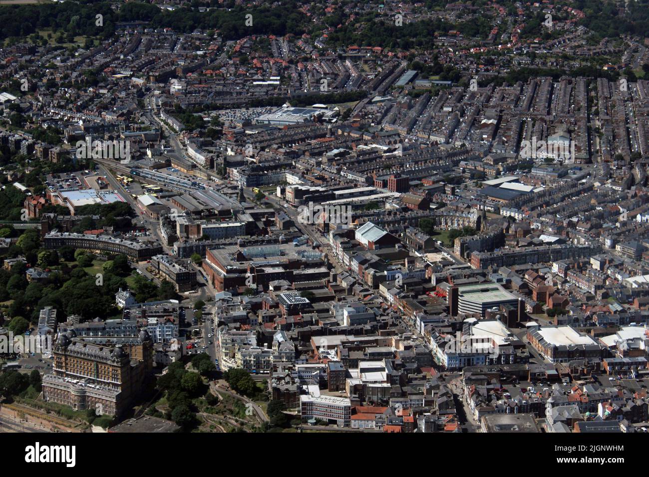 Aerial photo Scarborough town centre showing main street and shopping area, Grand hotel and Town Hall with Falsgrave and Sainsbury in the background Stock Photo