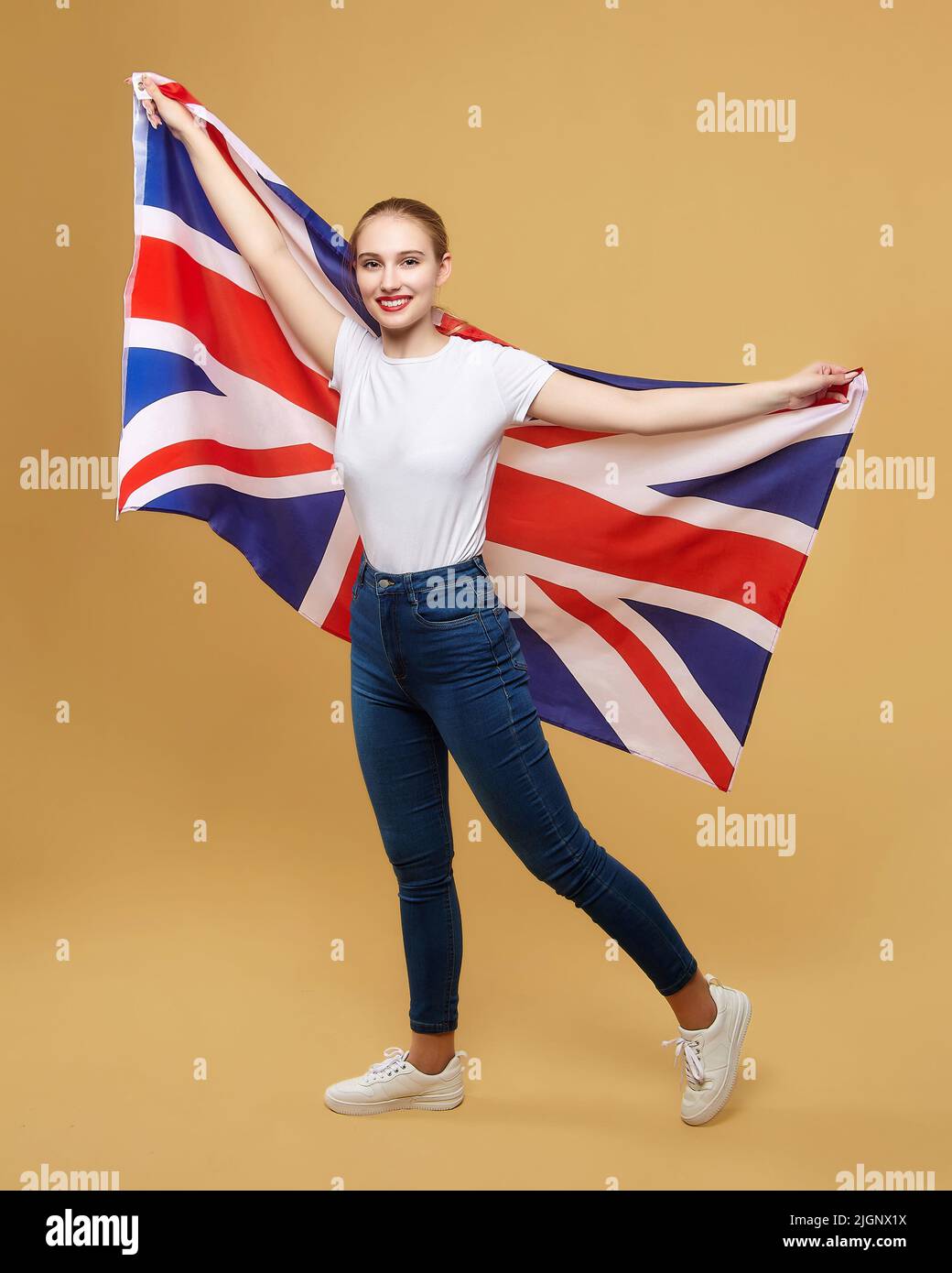The greatest nation. Portrait of a happy young boy standing in front of the  Union Jack Stock Photo - Alamy