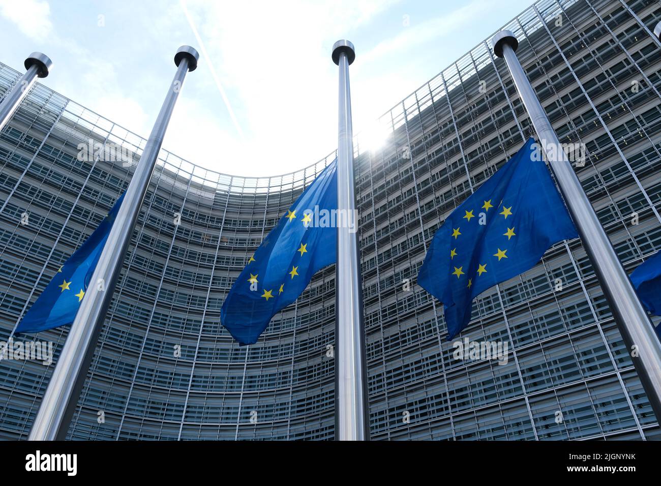 Brussels, Belgium. 12th July, 2022. European flags are flown at half-mast for the funeral of Shinzo ABE, former Japanese Prime Minister in front of Headquarters of European Union in Brussels, Belgium on July 12, 2022. Credit: ALEXANDROS MICHAILIDIS/Alamy Live News Stock Photo