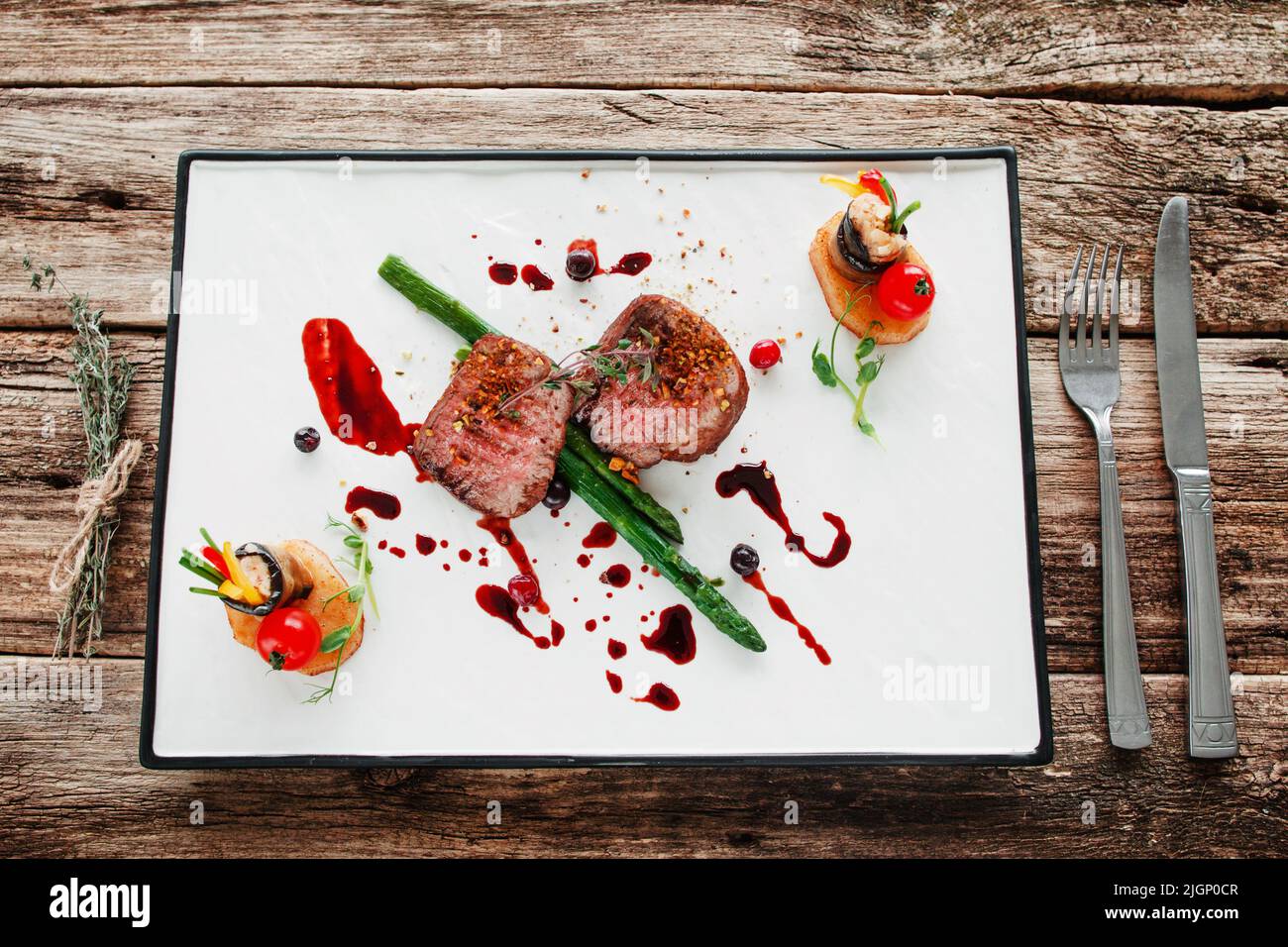 Portion of veal medallions and vegetables flat lay Stock Photo