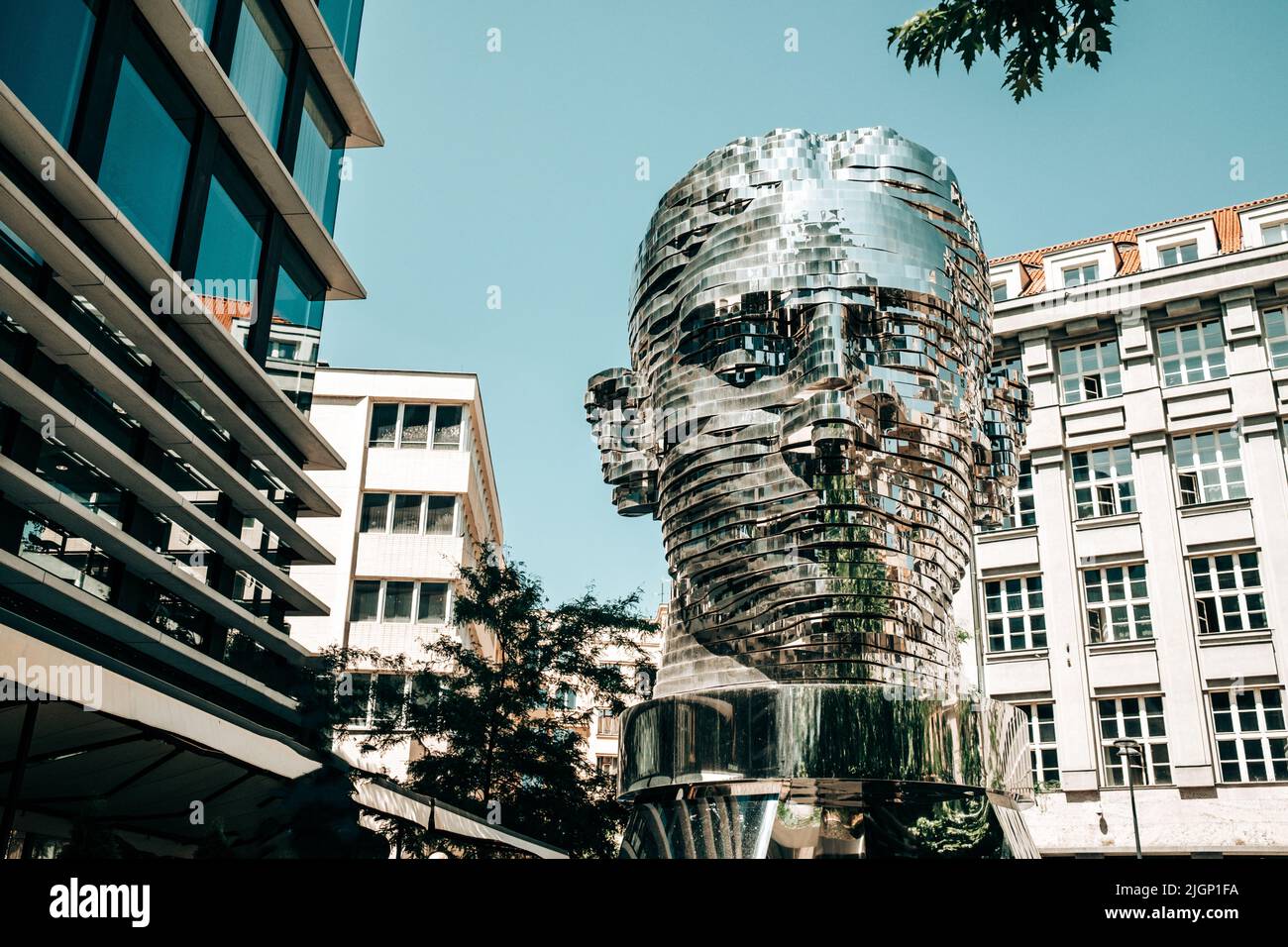 Moving mirror statue of Franz Kafka by David Cerny. Big metalmorphosis head sculpture. Stock Photo