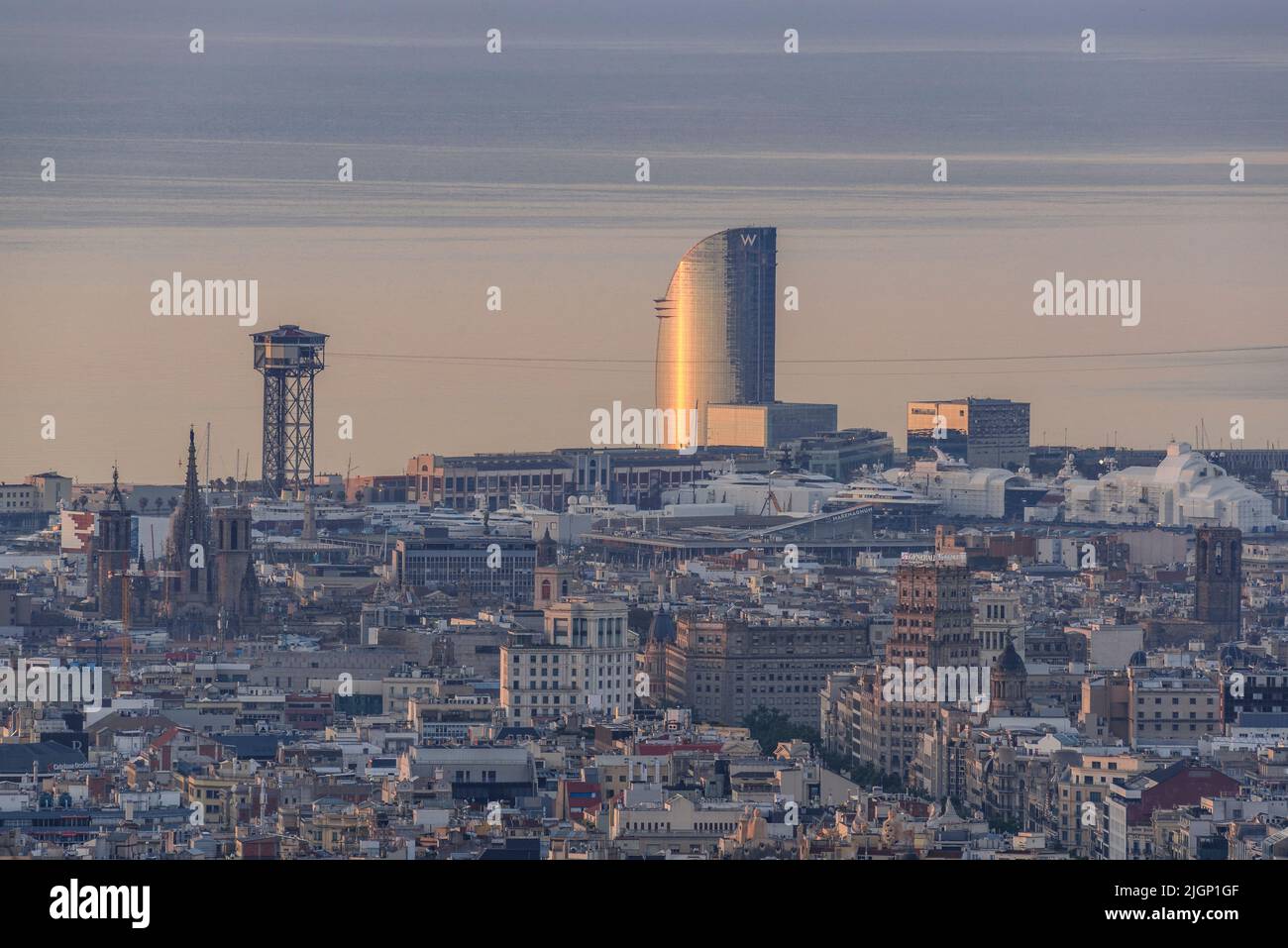 Sunrise in Barcelona and the W hotel tower seen from the Tibidabo mountain (Barcelona, Catalonia, Spain) ESP: Amanecer en Barcelona y el Hotel Vela Stock Photo