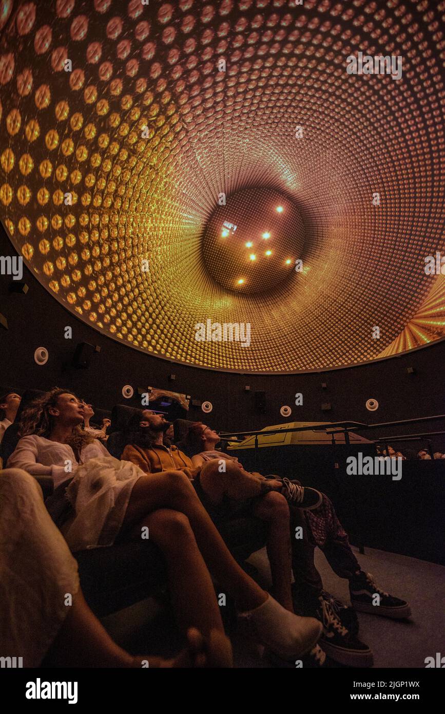 Tourists at the 'Ull del Montsec' planetarium during the projection of the video about the night, the Milky Way and astronomy (Àger, Lleida, Spain) Stock Photo