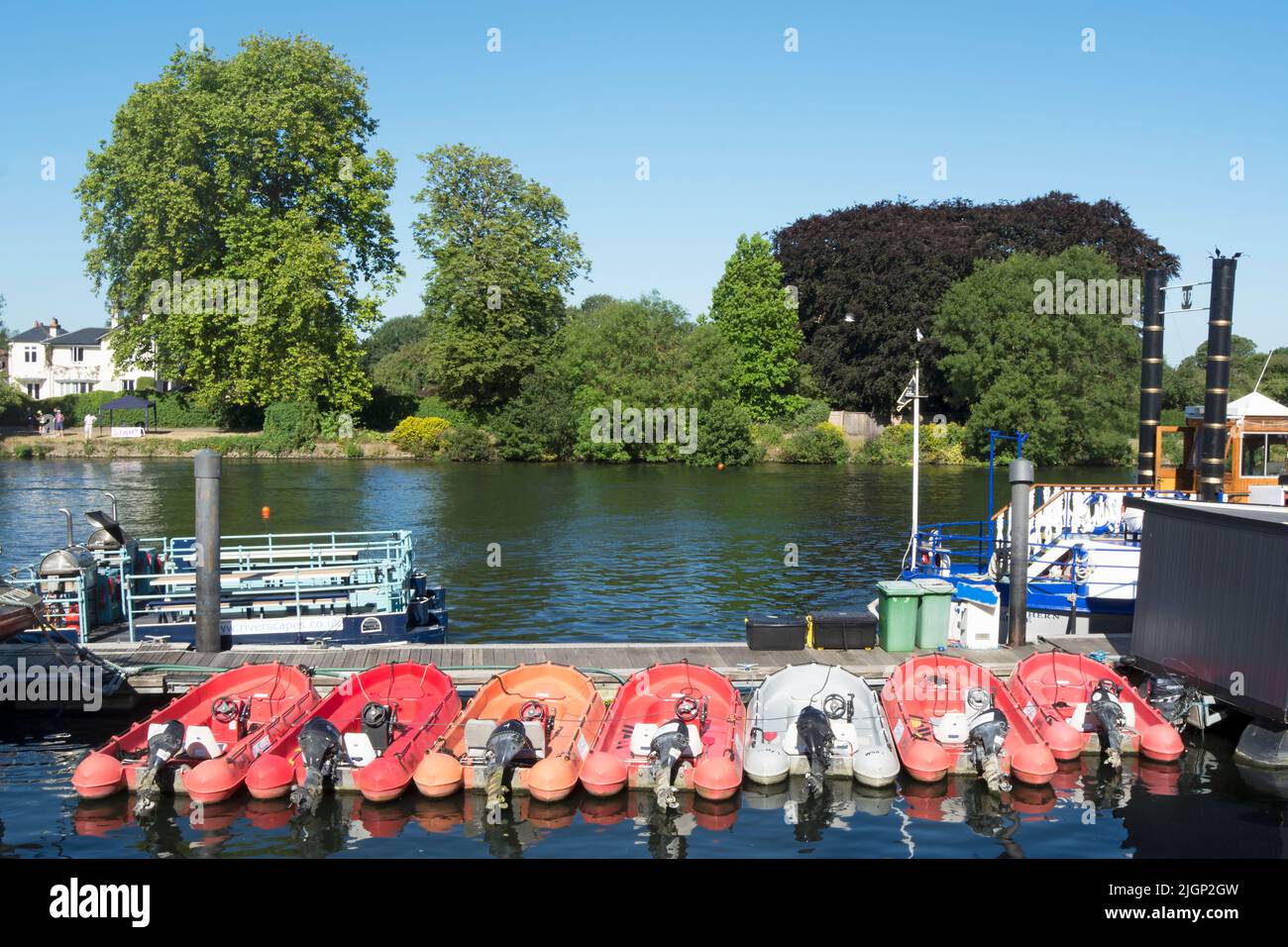 row of self-drive boats for hire, from the company riverscapes, moored on the river thames at kingston upon thames, surrey, england Stock Photo