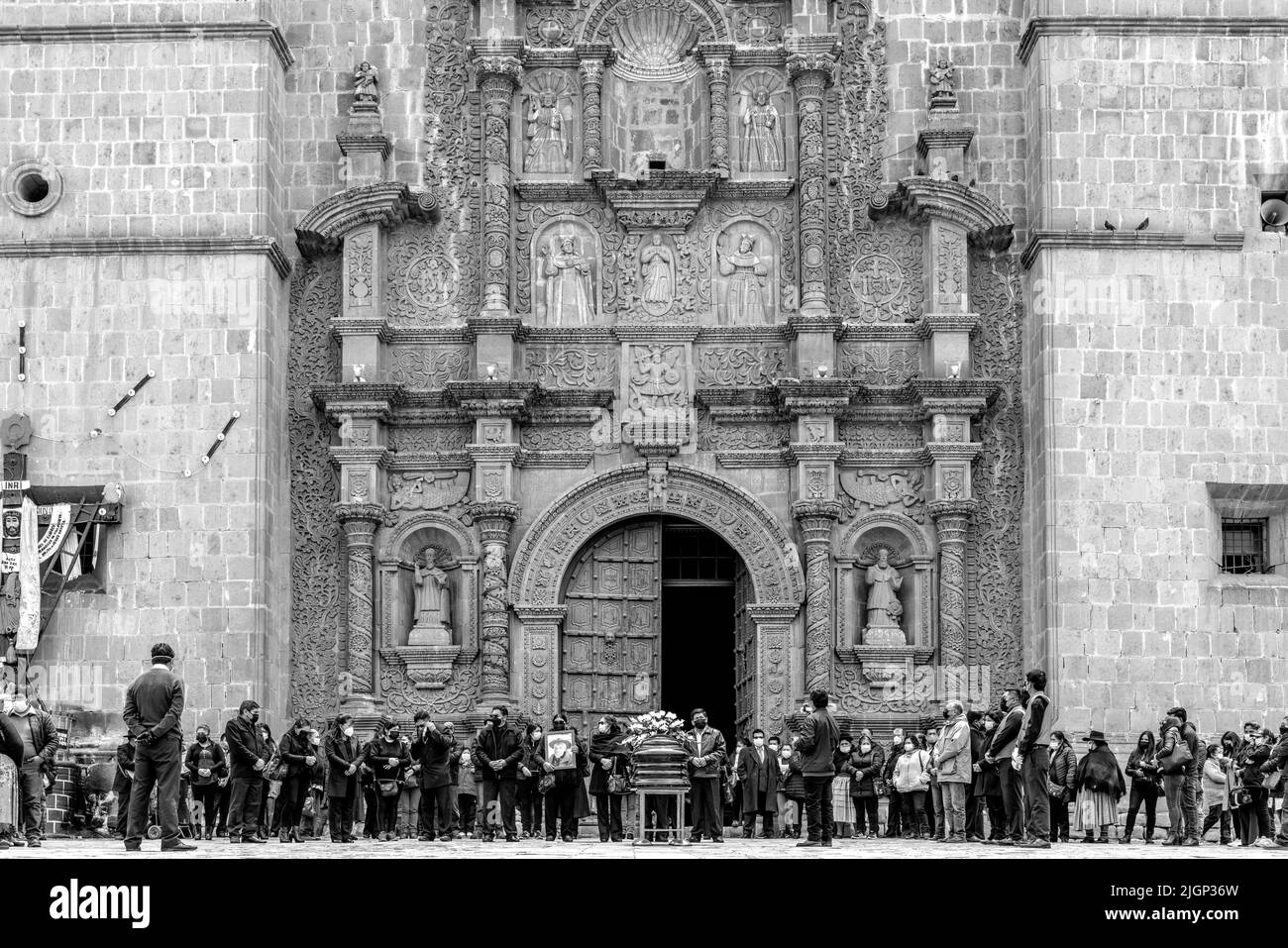 Local People Attend A Funeral At The Puno Cathedral In Plaza De Armas, Puno, Puno Province, Peru. Stock Photo