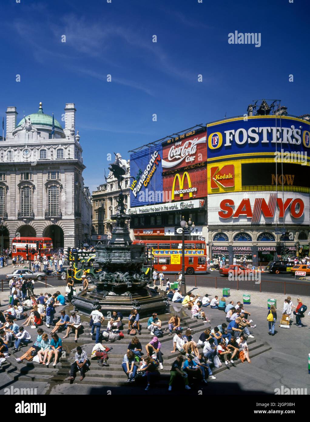 1989 HISTORICAL RED BUSES PICCADILLY CIRCUS WEST END LONDON ENGLAND UK Stock Photo