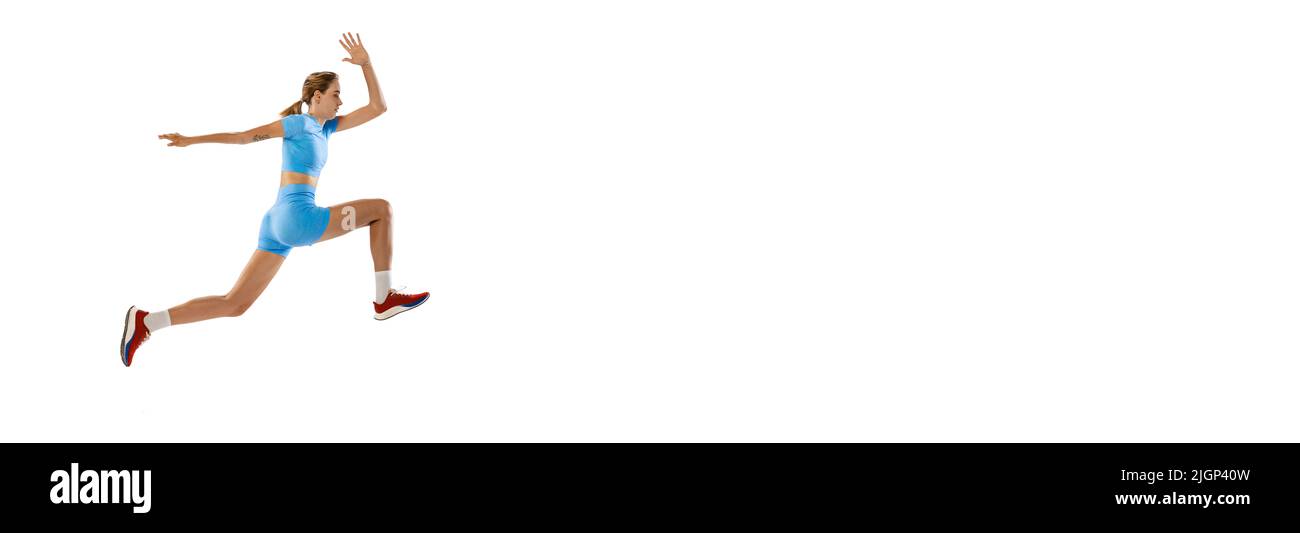 Triple jump technique. Studio shot of female athlete in sports uniform