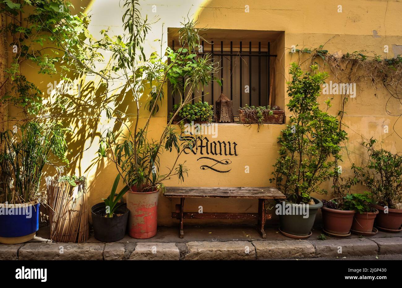 Marseille, France, May 2022, view of a bench and plants in a street of Le Panier district Stock Photo