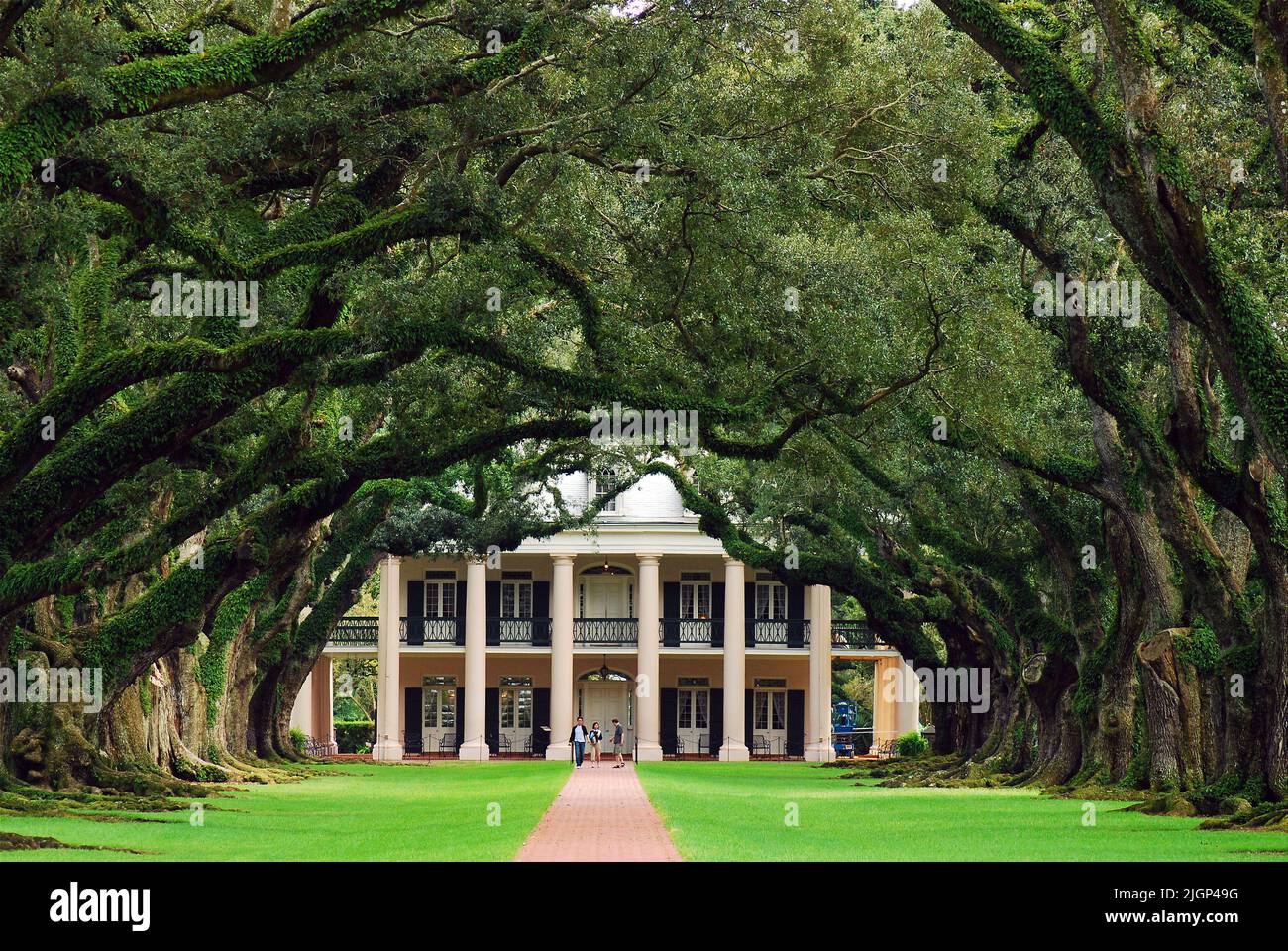 Visitors stroll the grounds of Vacherie Plantation, known as Oak Alley Plantation, one of the most visited plantation homes in the New Orleans area Stock Photo