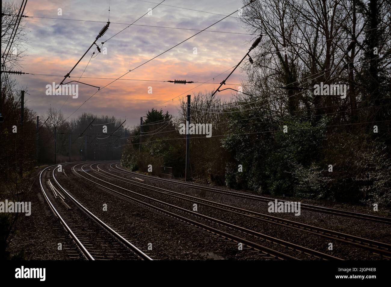 Catenary and track on the West Coast Main Line on a cold January day in England. Stock Photo
