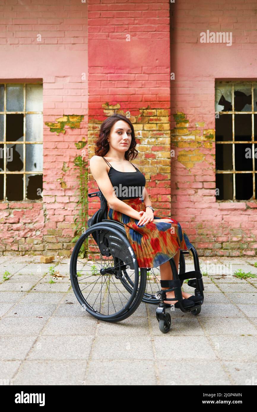 Portrait of a Caucasian woman in a wheelchair with resolute stare. Strong independent woman. Stock Photo