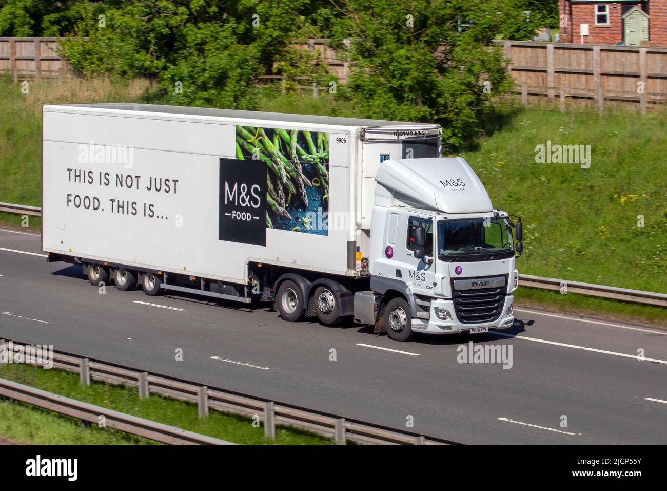 M&S, 'M&S'  Marks and Spencer, MS Supermarket DAF CF, wheels mid-lift  delivery vehicle, 12902cc; travelling on the M6 Motorway, Manchester, UK Stock Photo