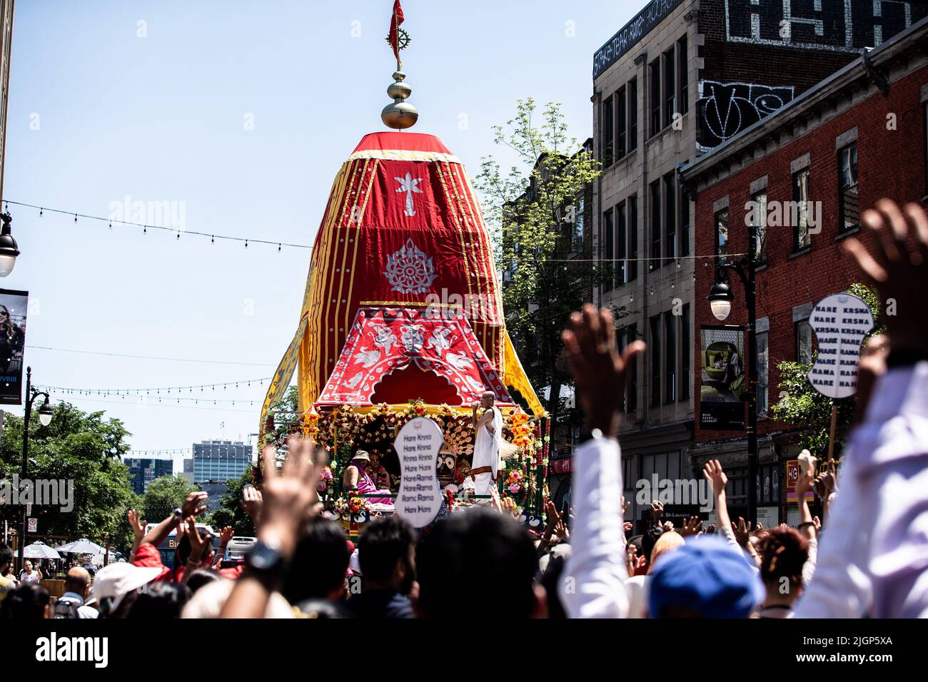 The crowd of devotees march with the main float cart during the celebration. Stock Photo