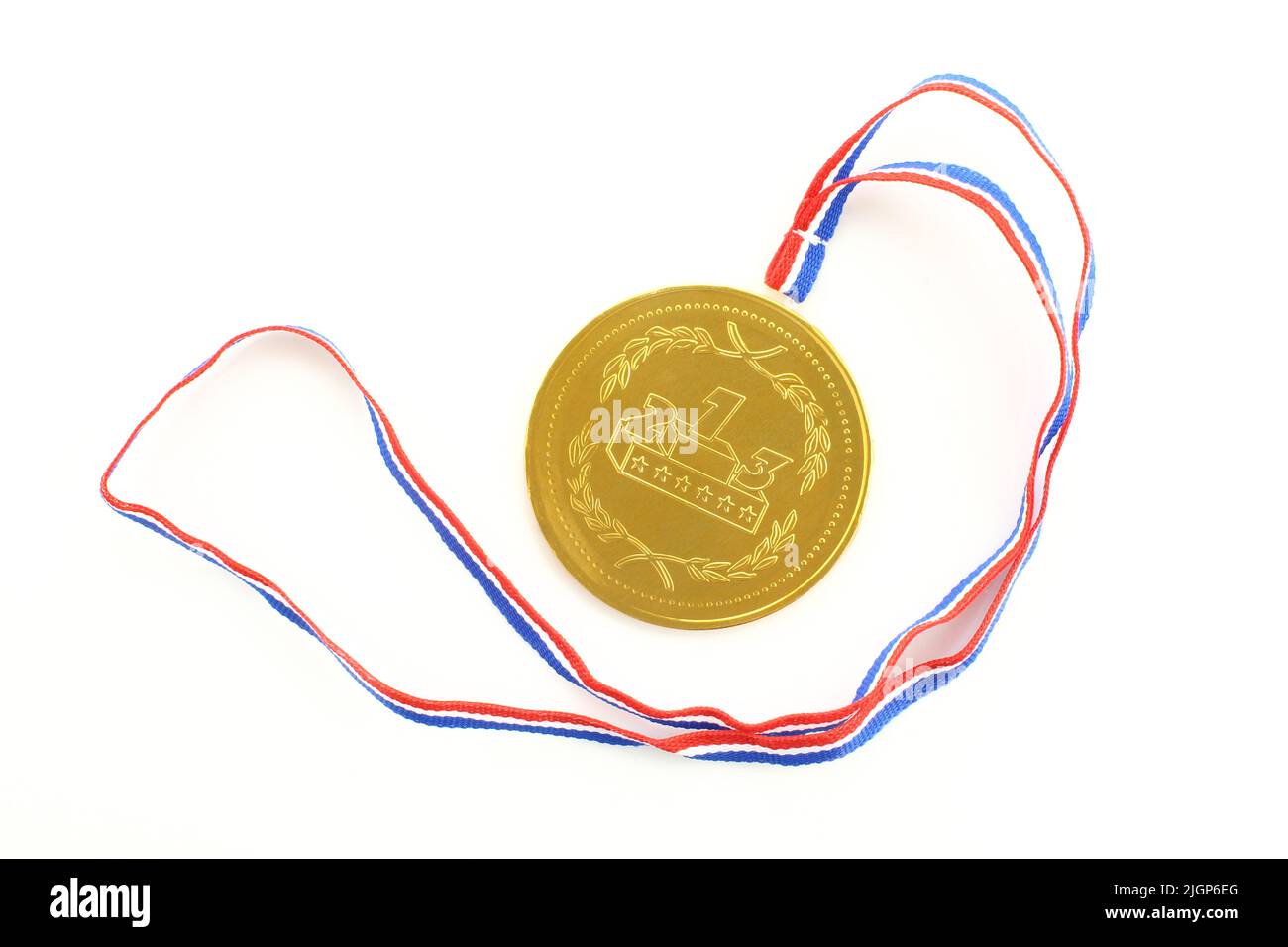 Golden medal prize and colorful ribbon. Round medallion isolated on white background Stock Photo
