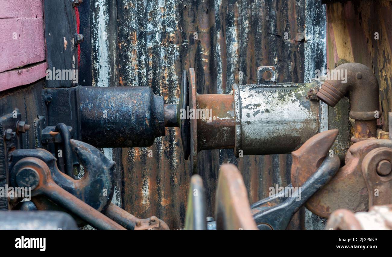 close-up of Old rusty iron coupling between two train carriages. Wagon buffers. Stock Photo