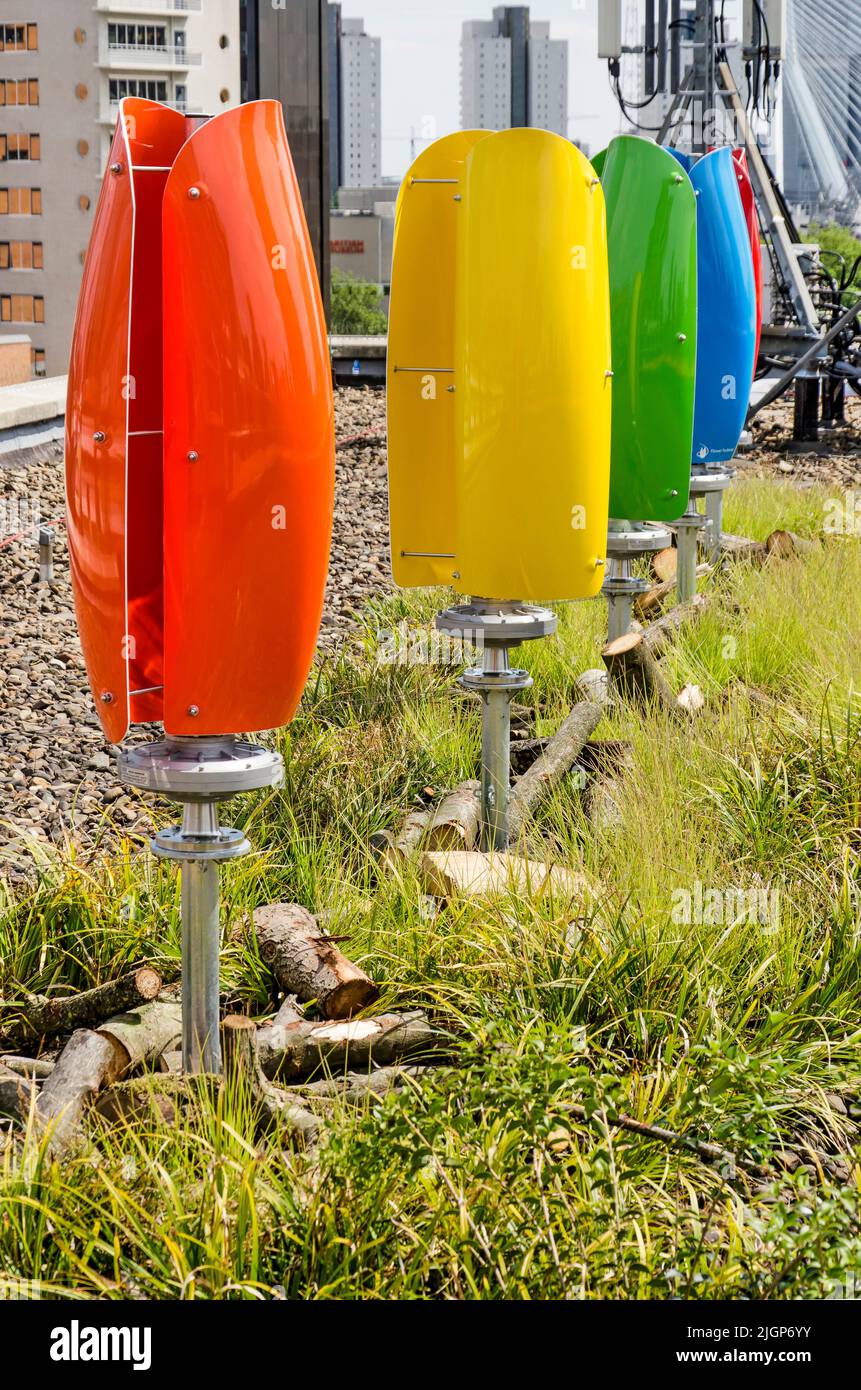 Rotterdam, The Netherlands, June 2, 2022: row of colorful vertical axis wind turbines on an urban rooftop Stock Photo
