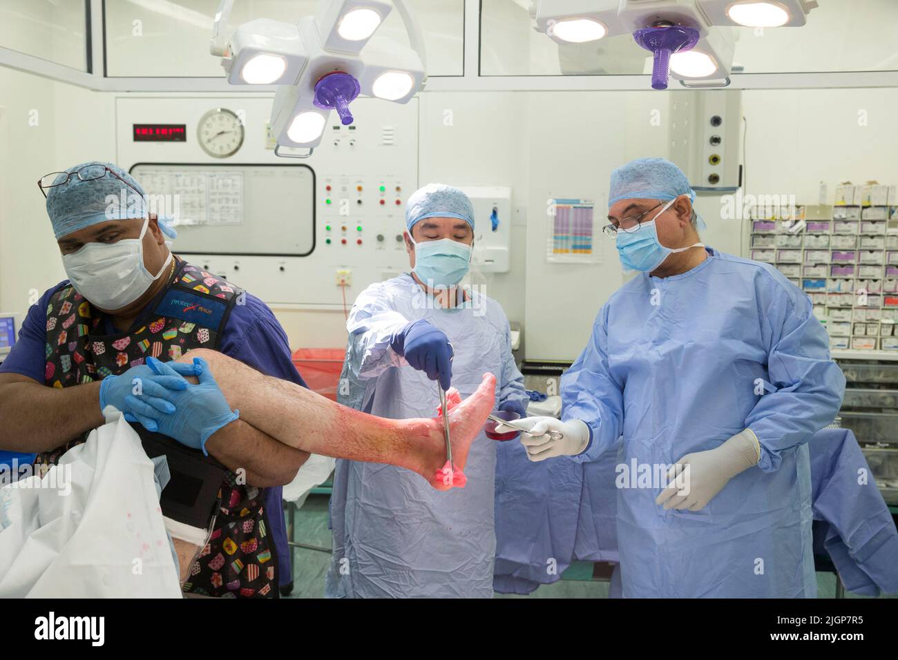 Hospital staff prepare a patient for foot surgery. The NHS is under