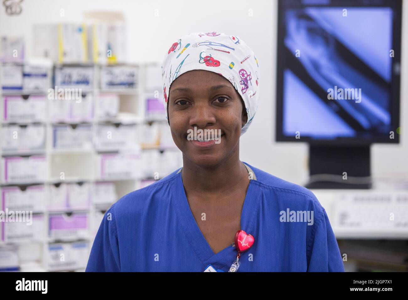 A nurse in scrubs in an operating theatre in an NHS hospital Stock