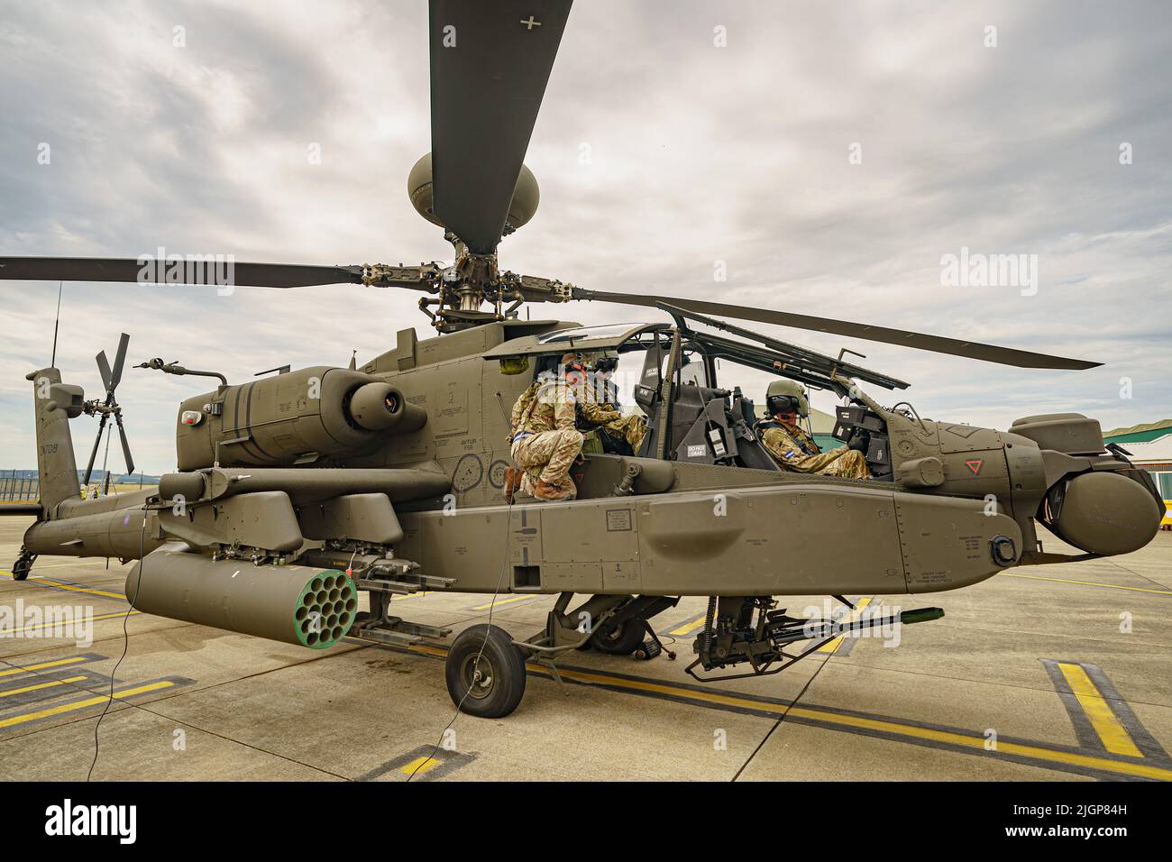 The Army Air Corps latest Apache AH-64E attack helicopter is prepared for flight by ground crew at the Army Aviation Centre at Middle Wallop, Stockbridge in Hampshire. Picture date: Tuesday July 12, 2022. Stock Photo