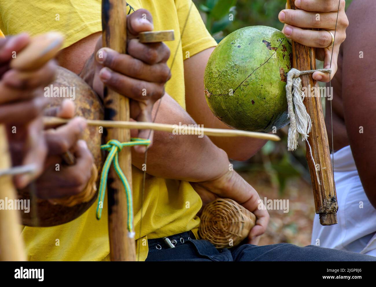 Musicians playing an instrument called berimbau during a capoeira performance in Salvador, Bahia Stock Photo