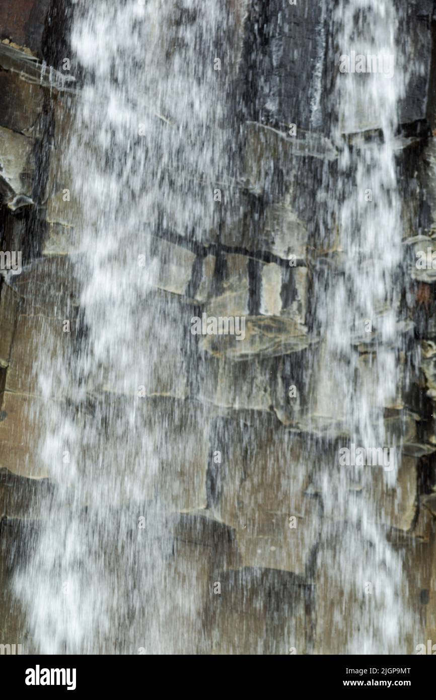 Svartifoss, Iceland. A thin, 20m waterfall down the center of a dramatic 3D wall of hexagonal basalt columns. Stock Photo