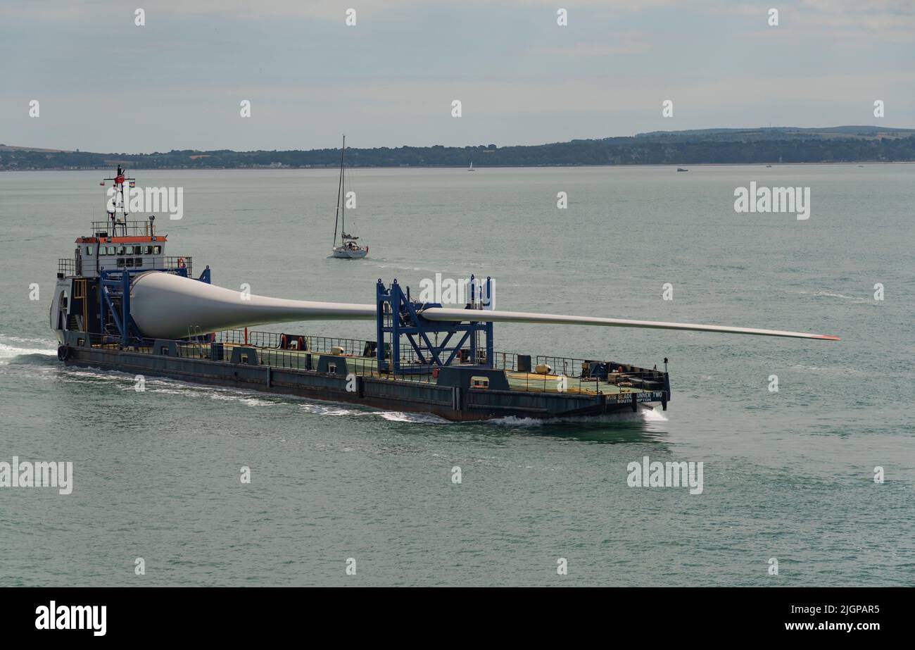 Portsmouth southern England UK. 2022. Wind turbine blade as cargo on Blade runner two  ship underway crossing The Solent bound for Portsmouth Harbour. Stock Photo