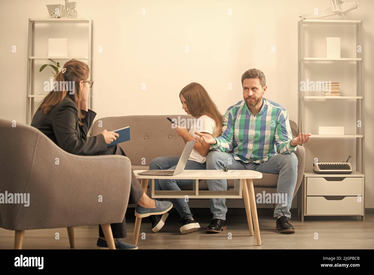 kid and dad talking to social worker. interpersonal relations. life coach. phone addiction Stock Photo