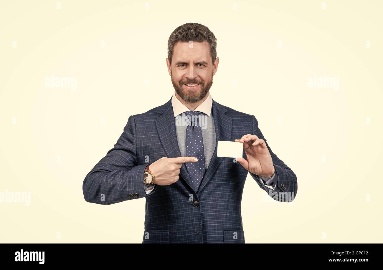 businessman man in suit pointing finger on empty debit or business card for copy space, contact me. Stock Photo