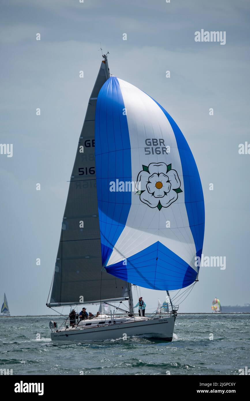 Lovely blue spinnaker on this Elan 40 sailing yacht White Rose cruising along to 6th place in her class at the Isle of Wight Round The Island race Stock Photo