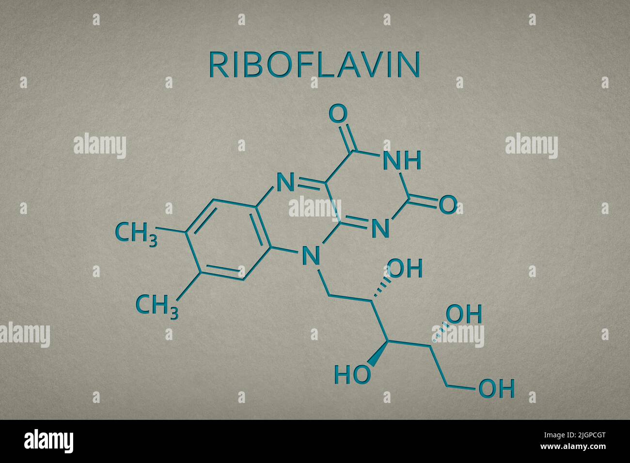 Vitamin B2. Riboflavin molecule on paper texture background. Skeletal