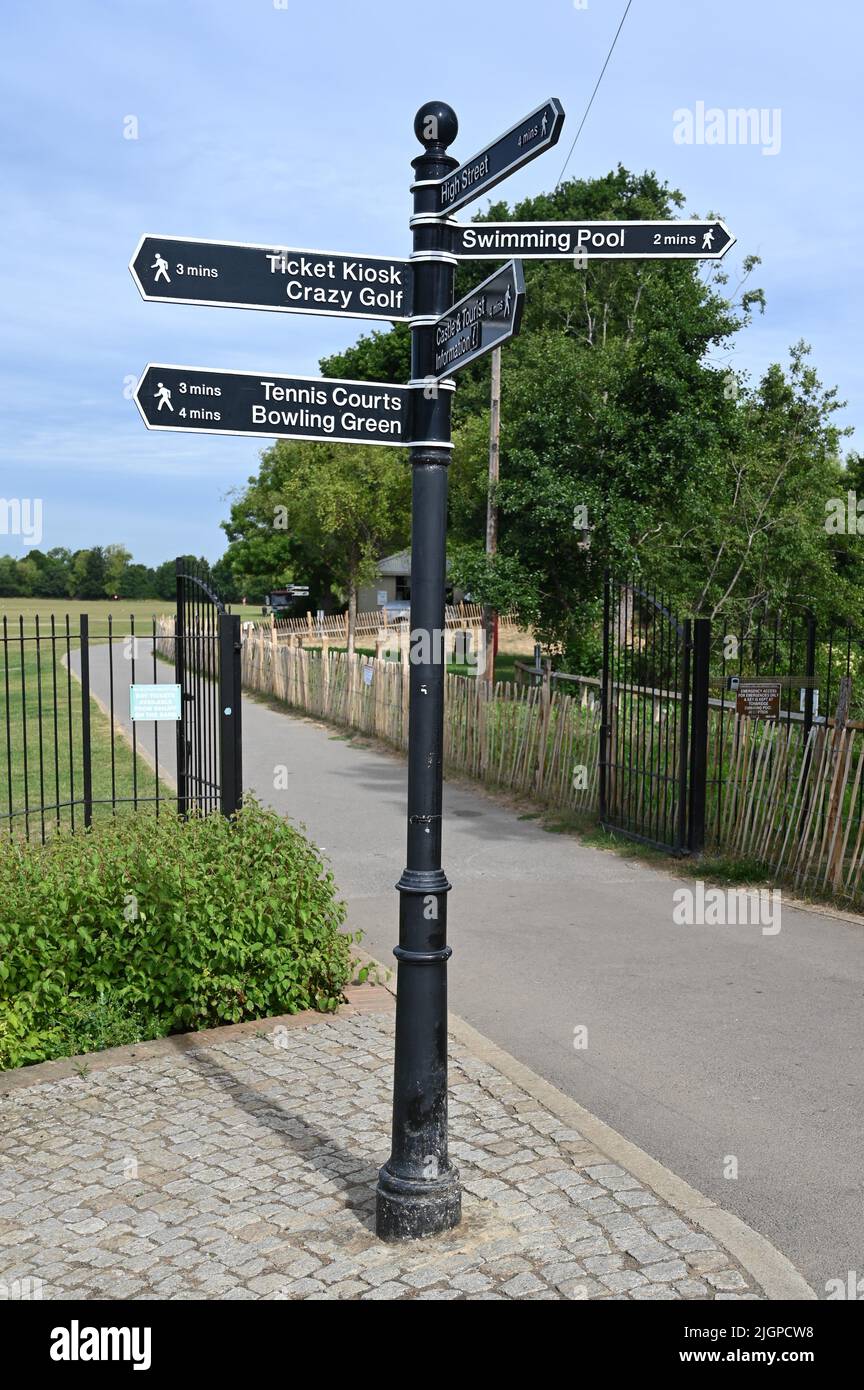 Sign post showing where pastimes are in Tonbridge, Kent. Stock Photo